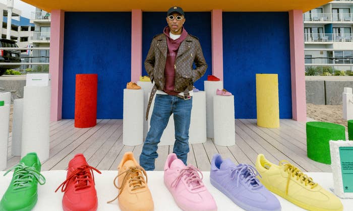Pharrell posing with his new Samba collection at Adidas&#x27; Something in the Water pop-up.