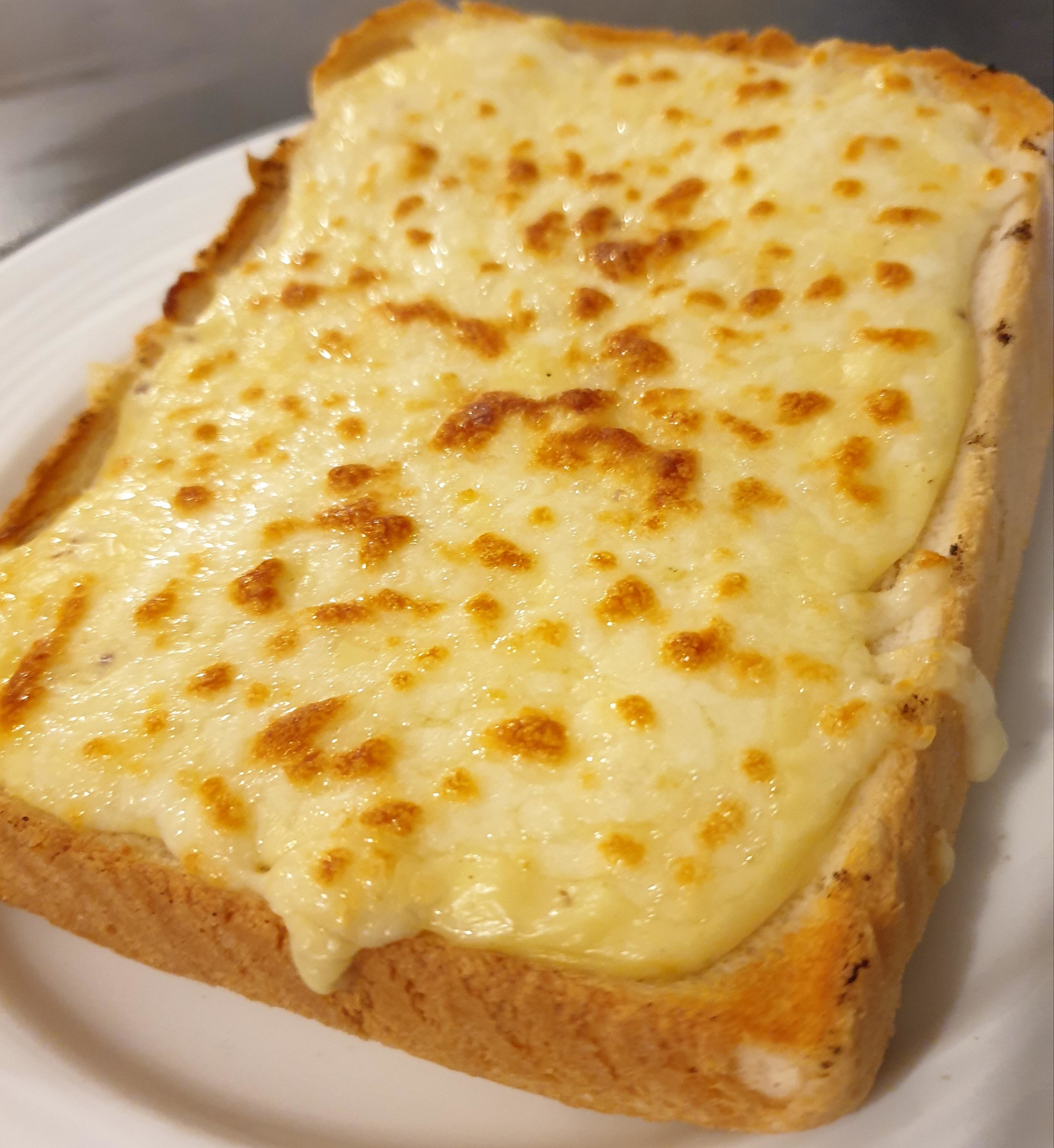 Toast with melted cheese.