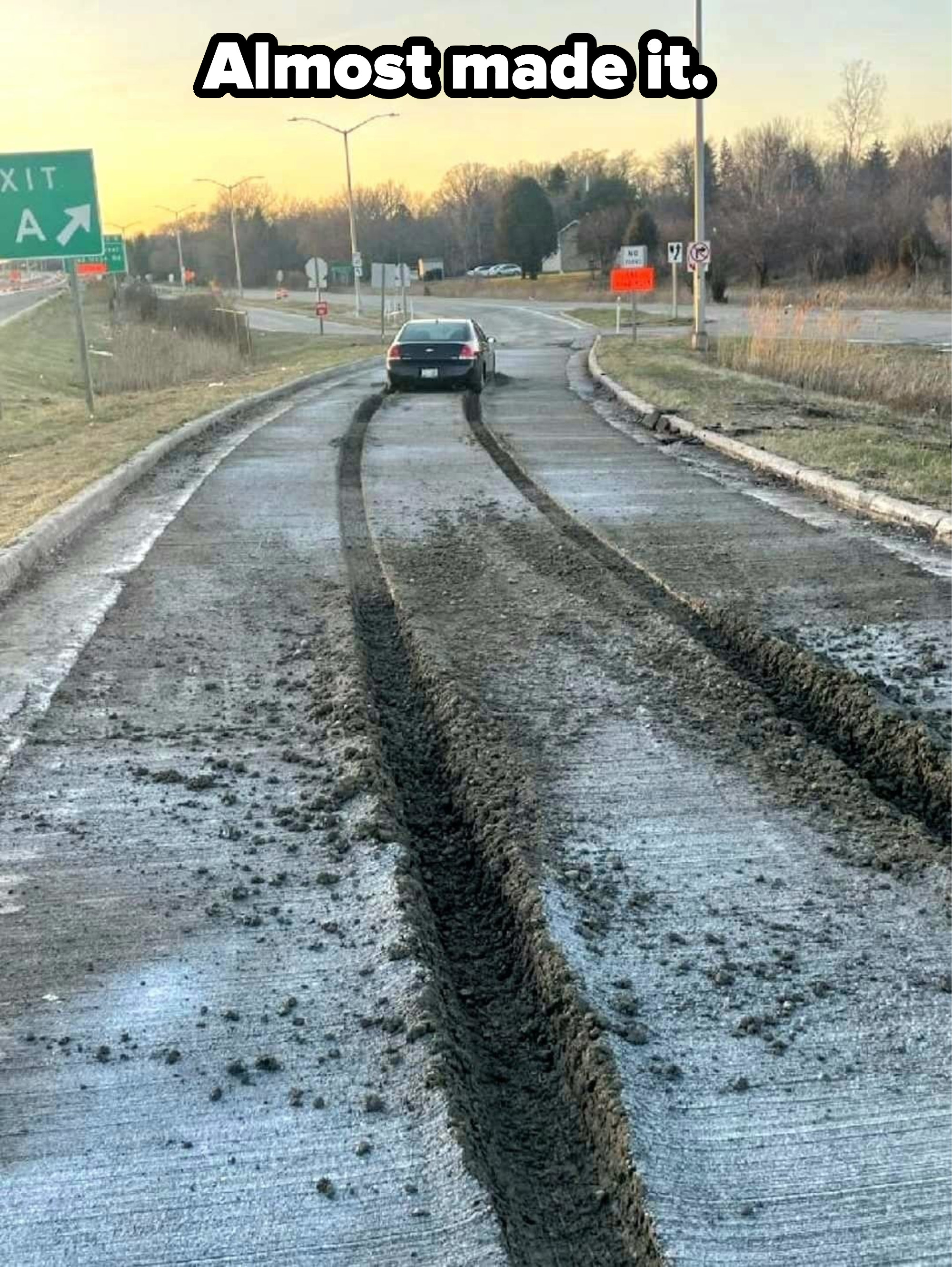A car driving through just-repaved roads