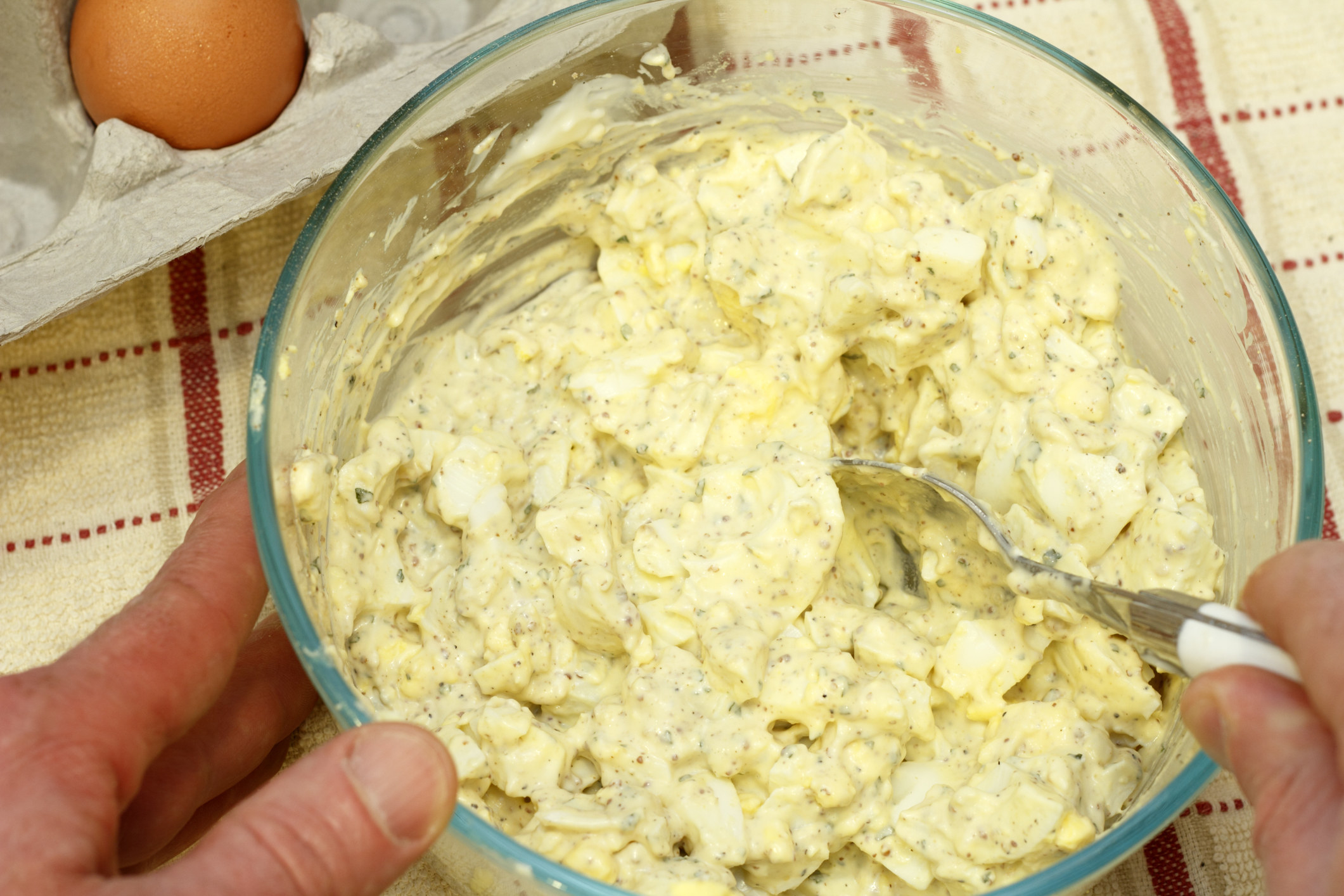 Preparing egg salad.