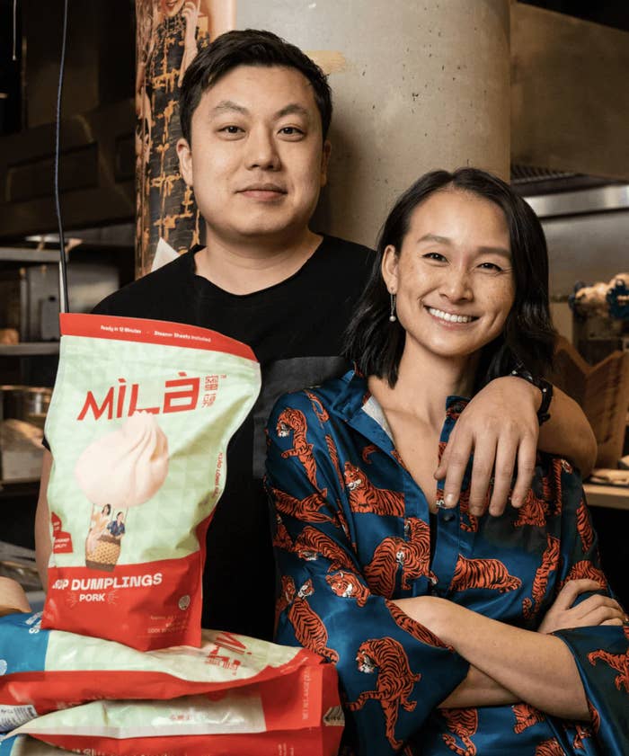 owners of company mila posing with dumplings