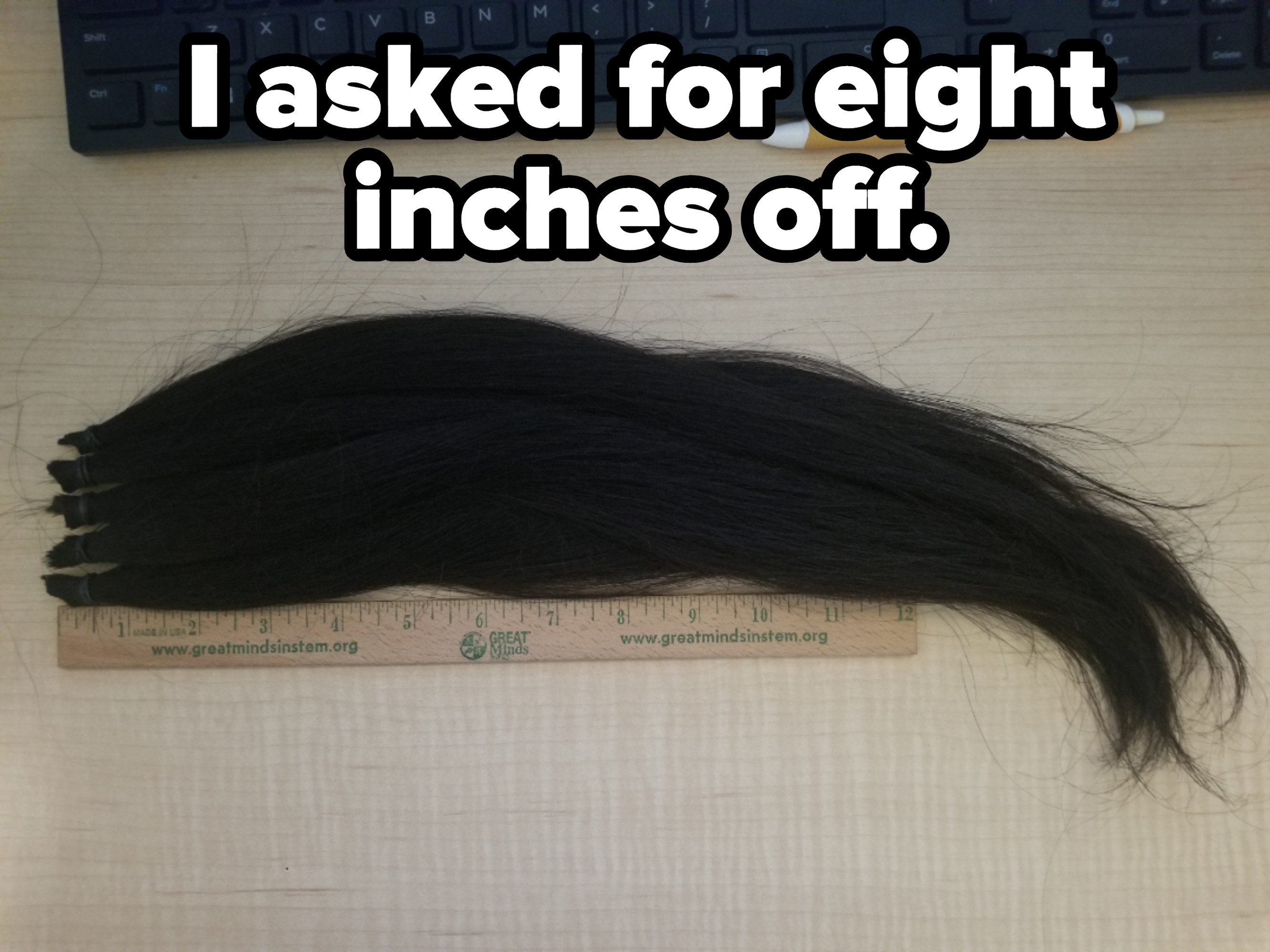 Hair laying next to a ruler