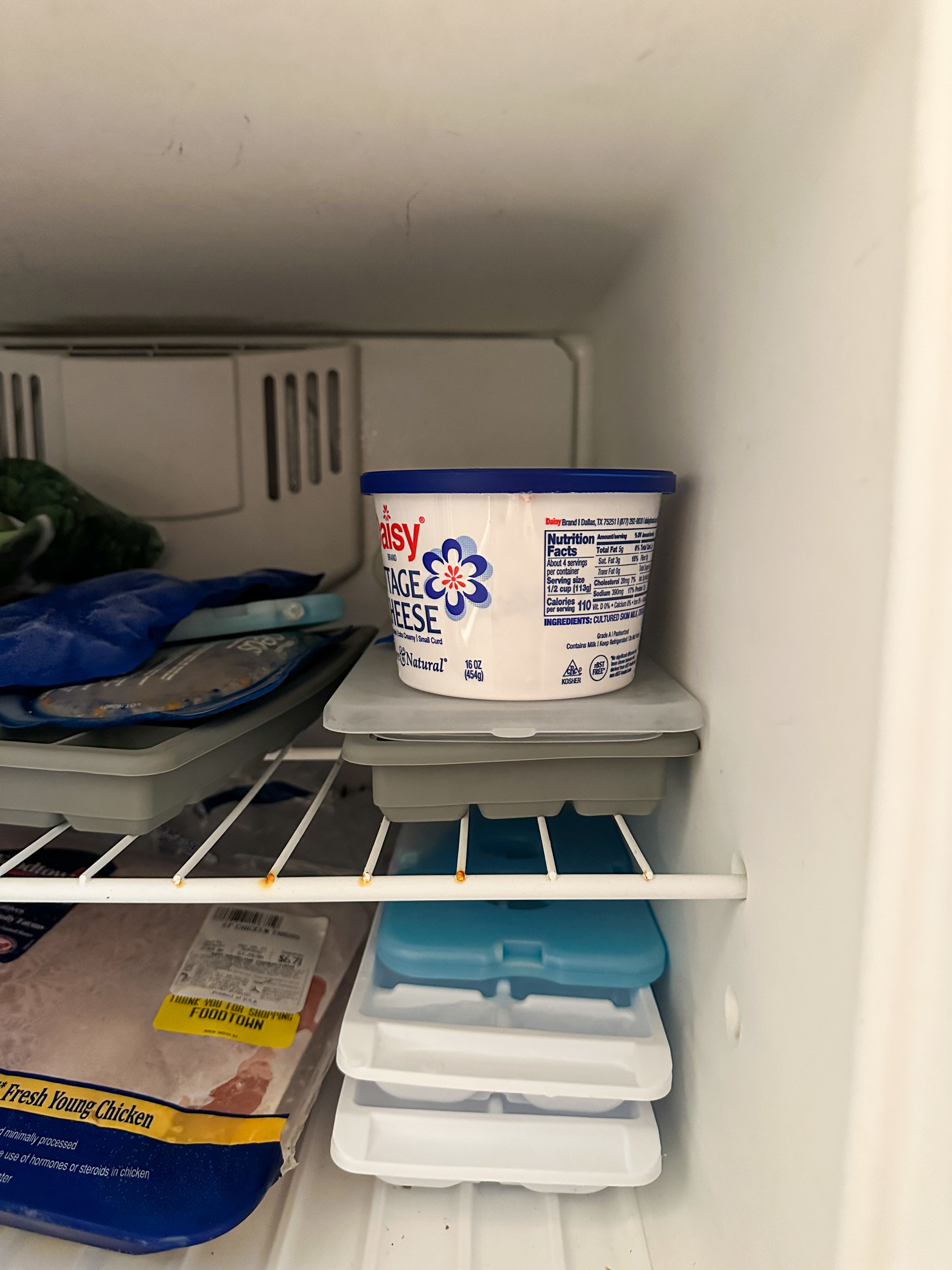 cottage cheese container (with ice cream inside) resting in the freezer