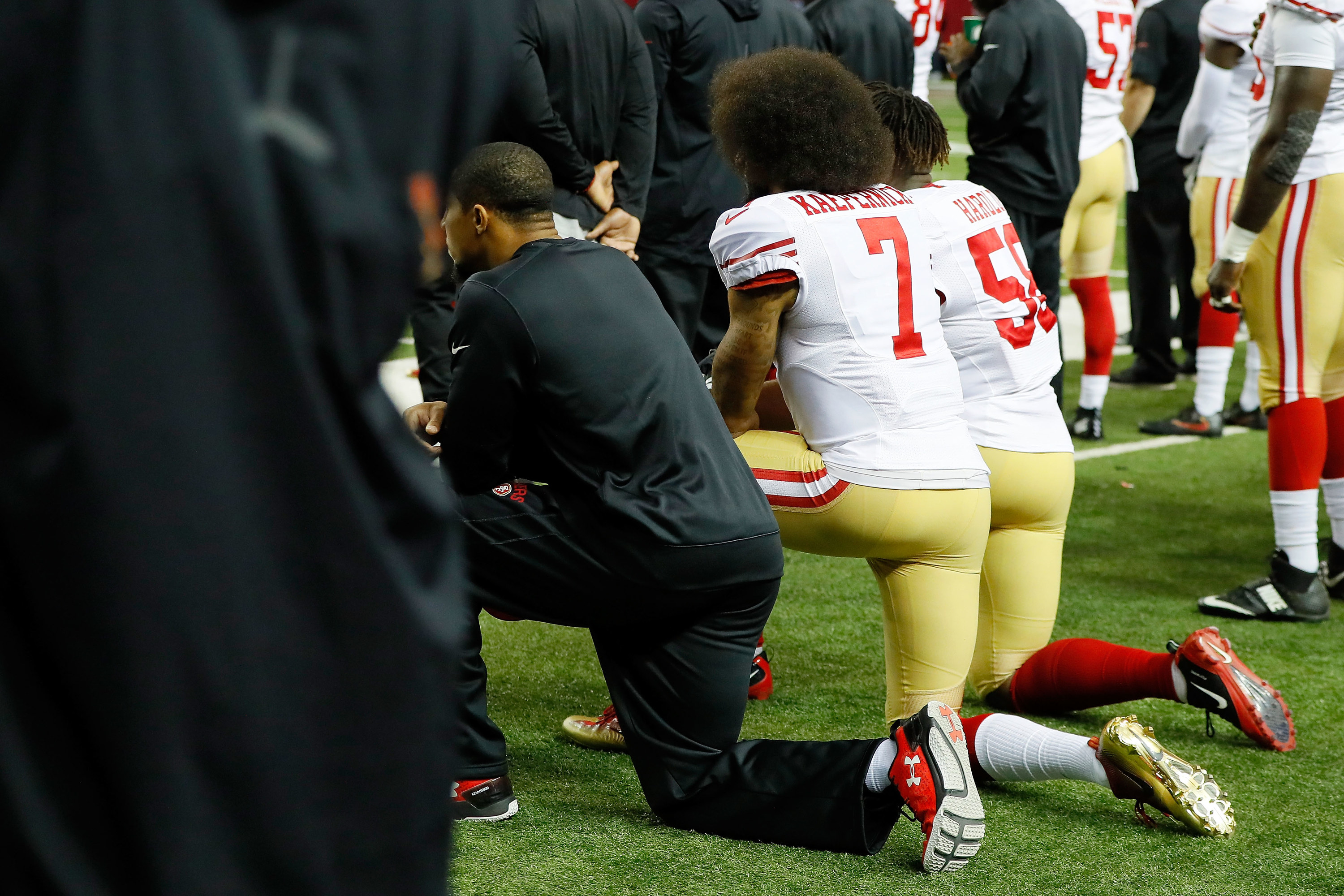 NFL players kneeling