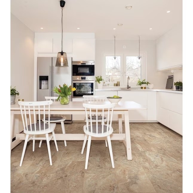 a kitchen with a tivoli travertine tiling on the floor