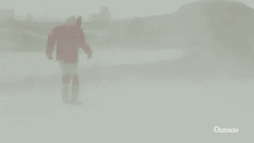 Gif of someone wading through a blizzard