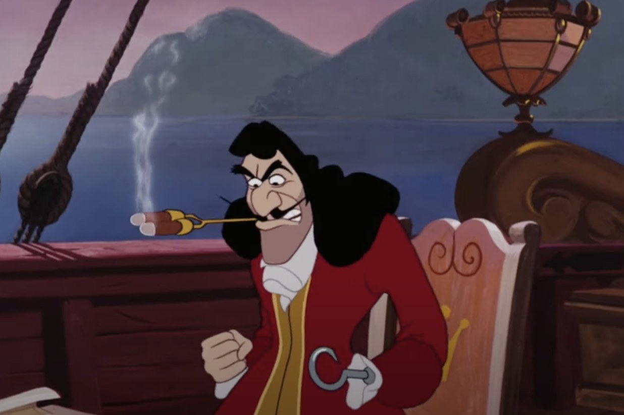 An animated man in a red coat smokes two cigars at once. He has one hand in a fist and the other is replaced by a hook.