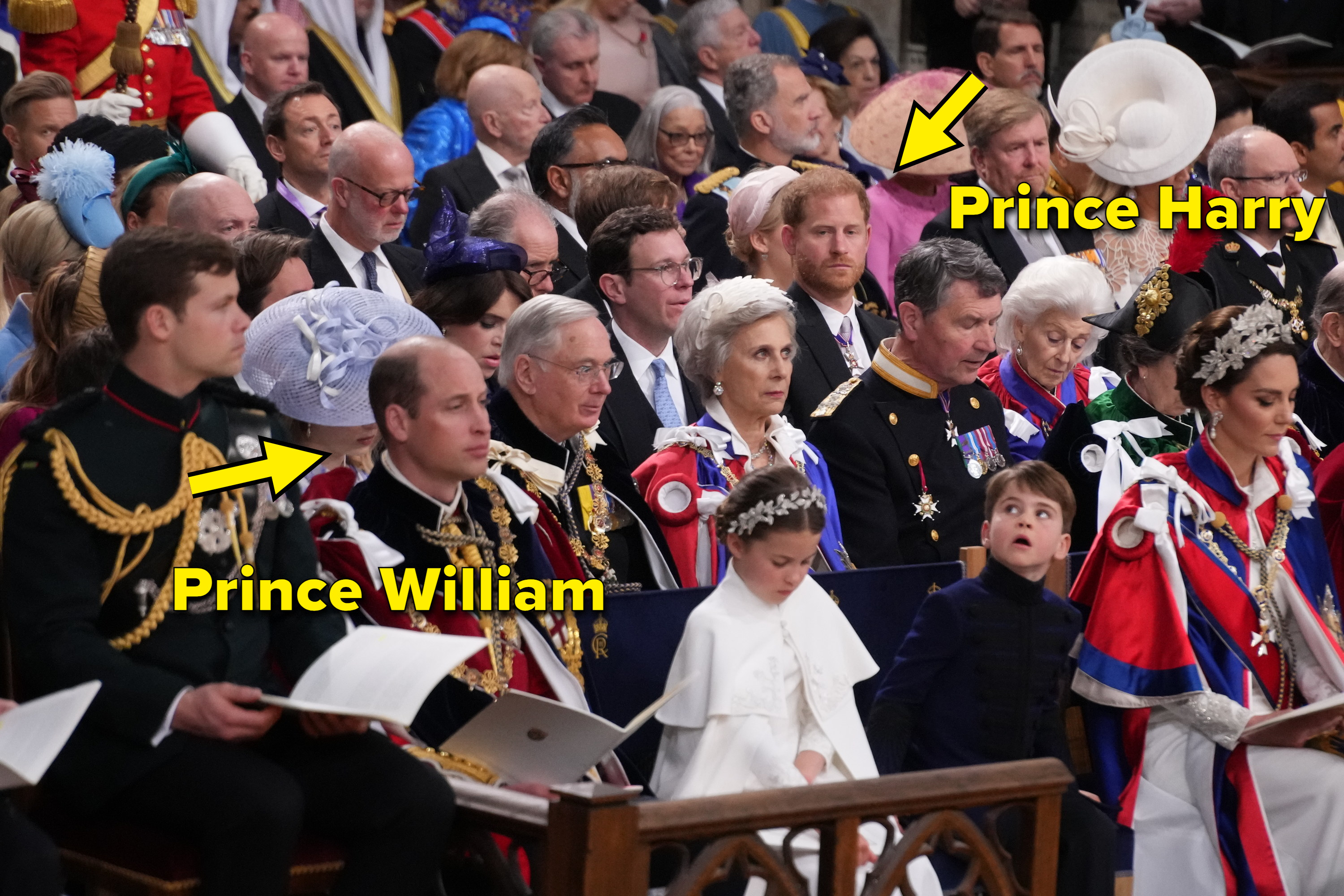arrow pointing to prince harry in a row behind prince william