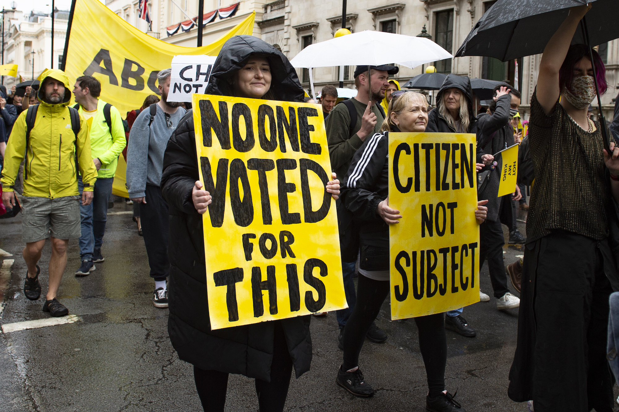 more protestors carrying signs