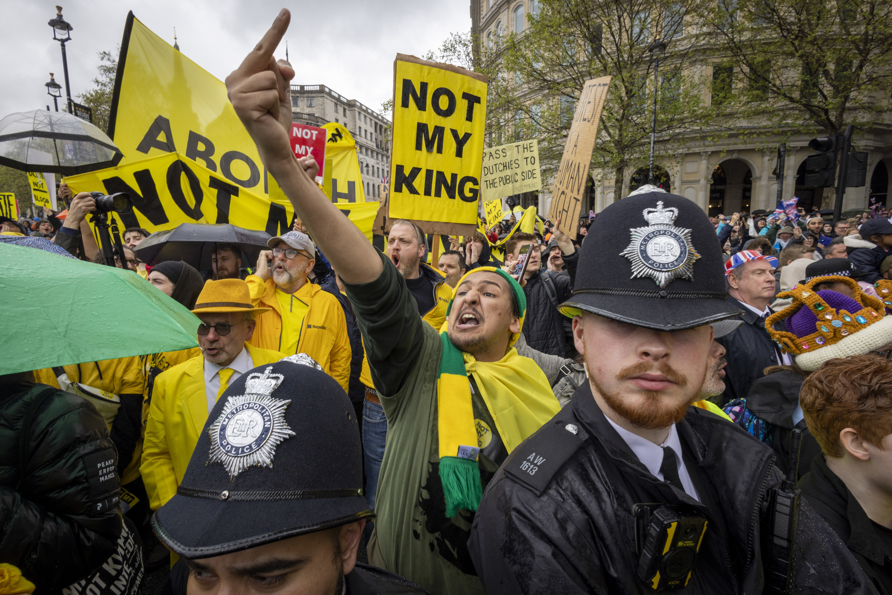 person flipping off the monarchy parade