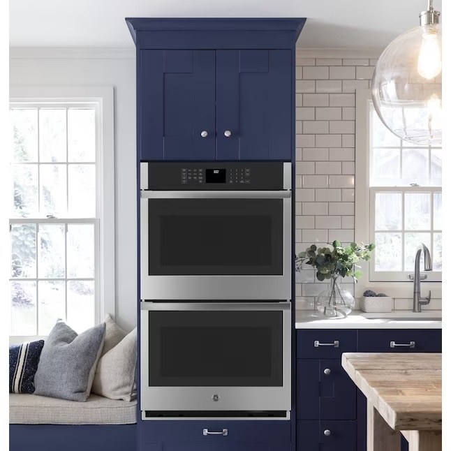 a stainless steel double over encased around a navy blue shelf