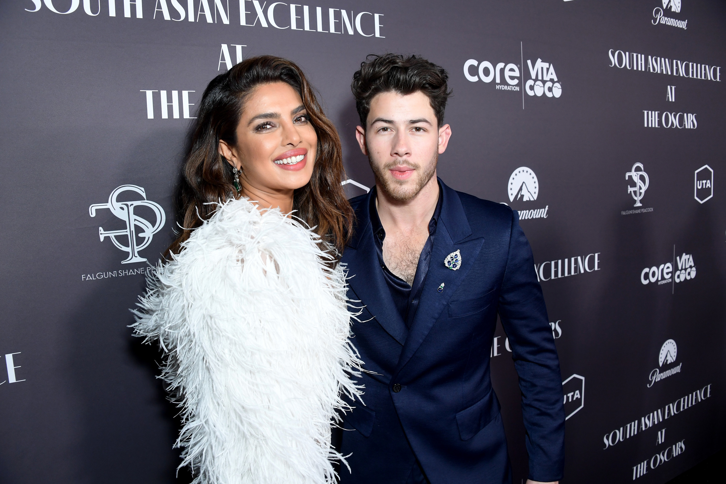 Priyanka Chopra and Joe Jonas pose together at a red carpet event