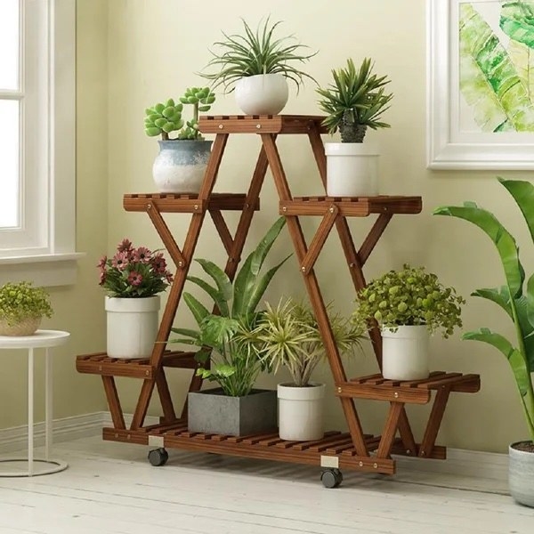 the plant stand with potted plants on it