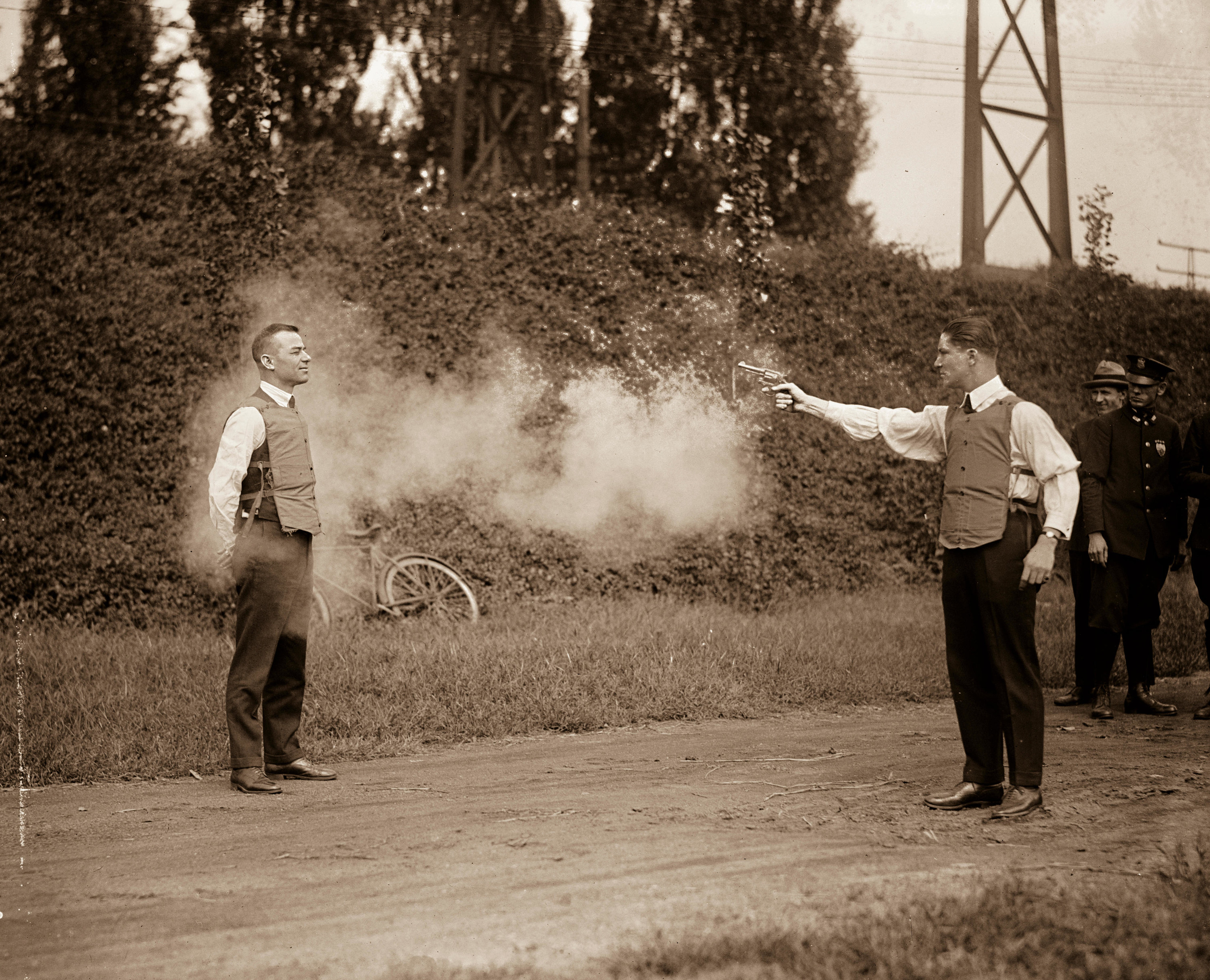 Two men testing bulletproof vests