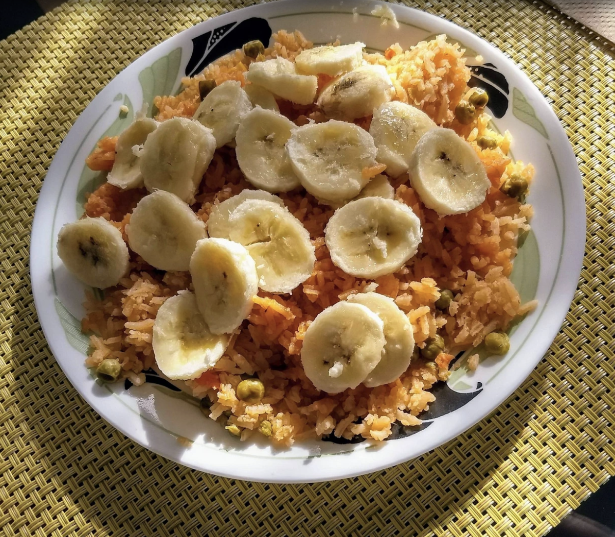 Mexican red rice with sliced banana.