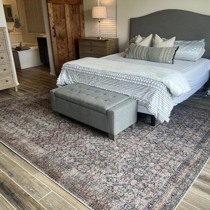 a user submitted photo of the rug in a bedroom