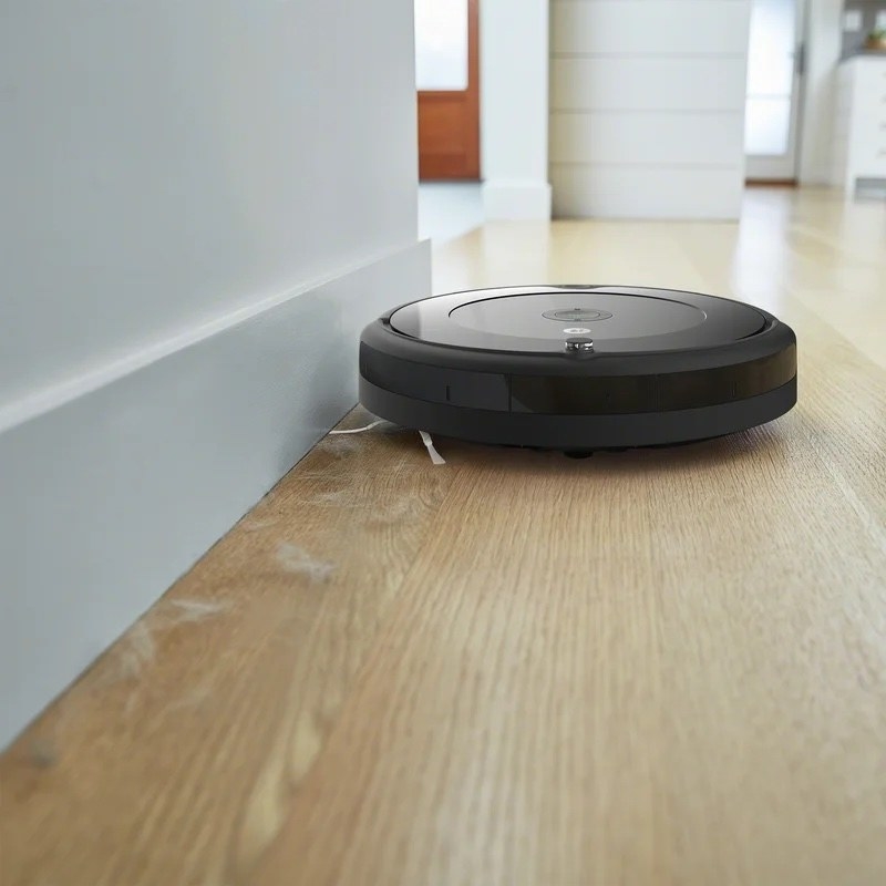 a roomba cleaning wood floors