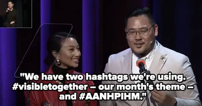 Jeannie and Philip onstage with caption referring to the two hashtags