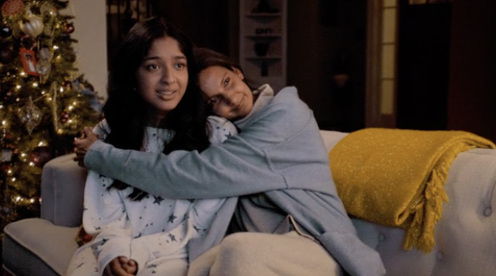 A woman hugging her daughter