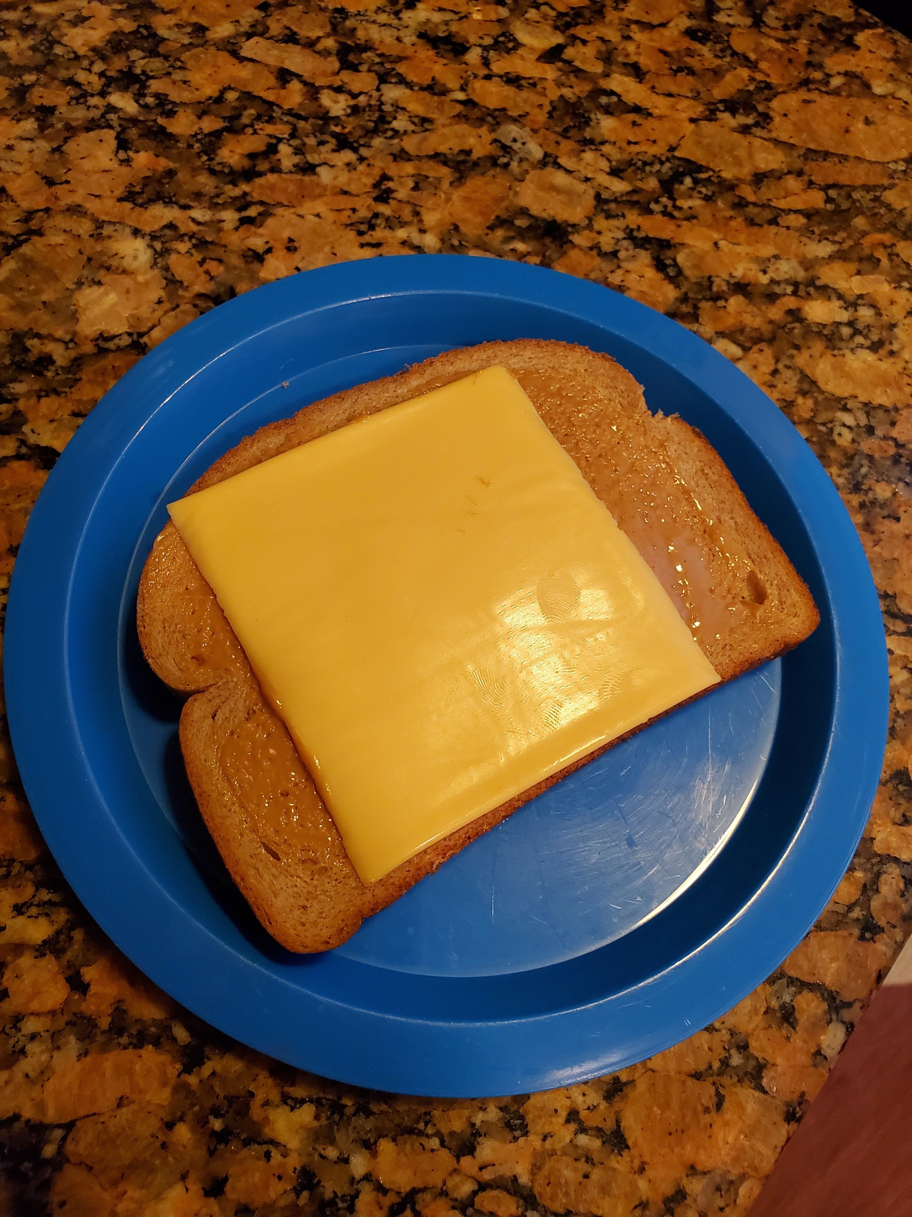 Bread with peanut butter and cheese.
