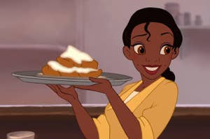 Tiana from The Princess and the Frog holding a plate of beignets