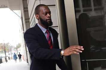 Pras Michel, a member of the 1990's hip-hop group the Fugees, arrives at U.S. District Court