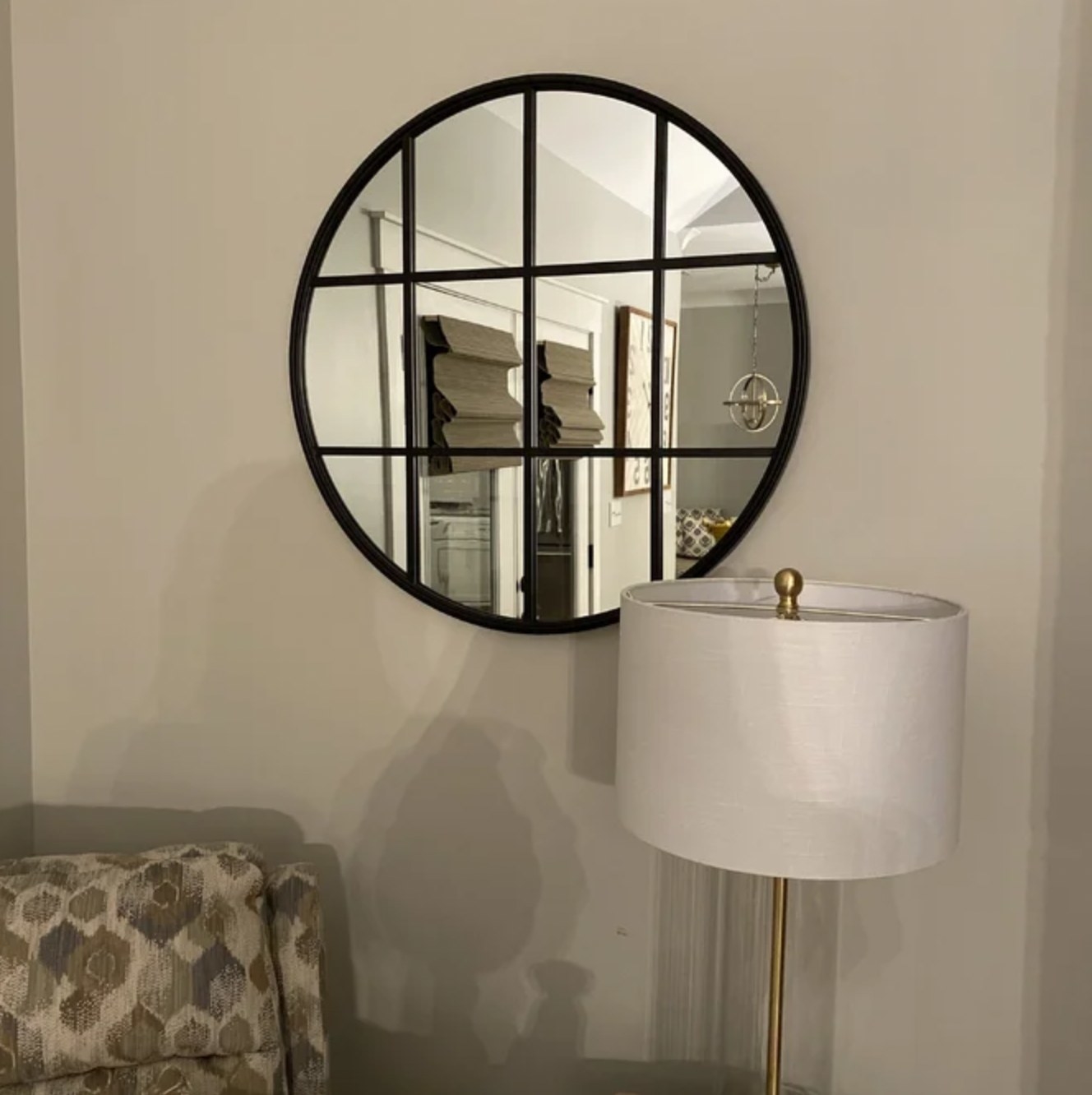 Reviewer's black mirror hanging on wall