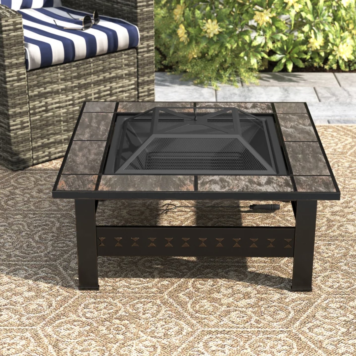 the fire pit on outdoor rug with no wood inside middle burning pit