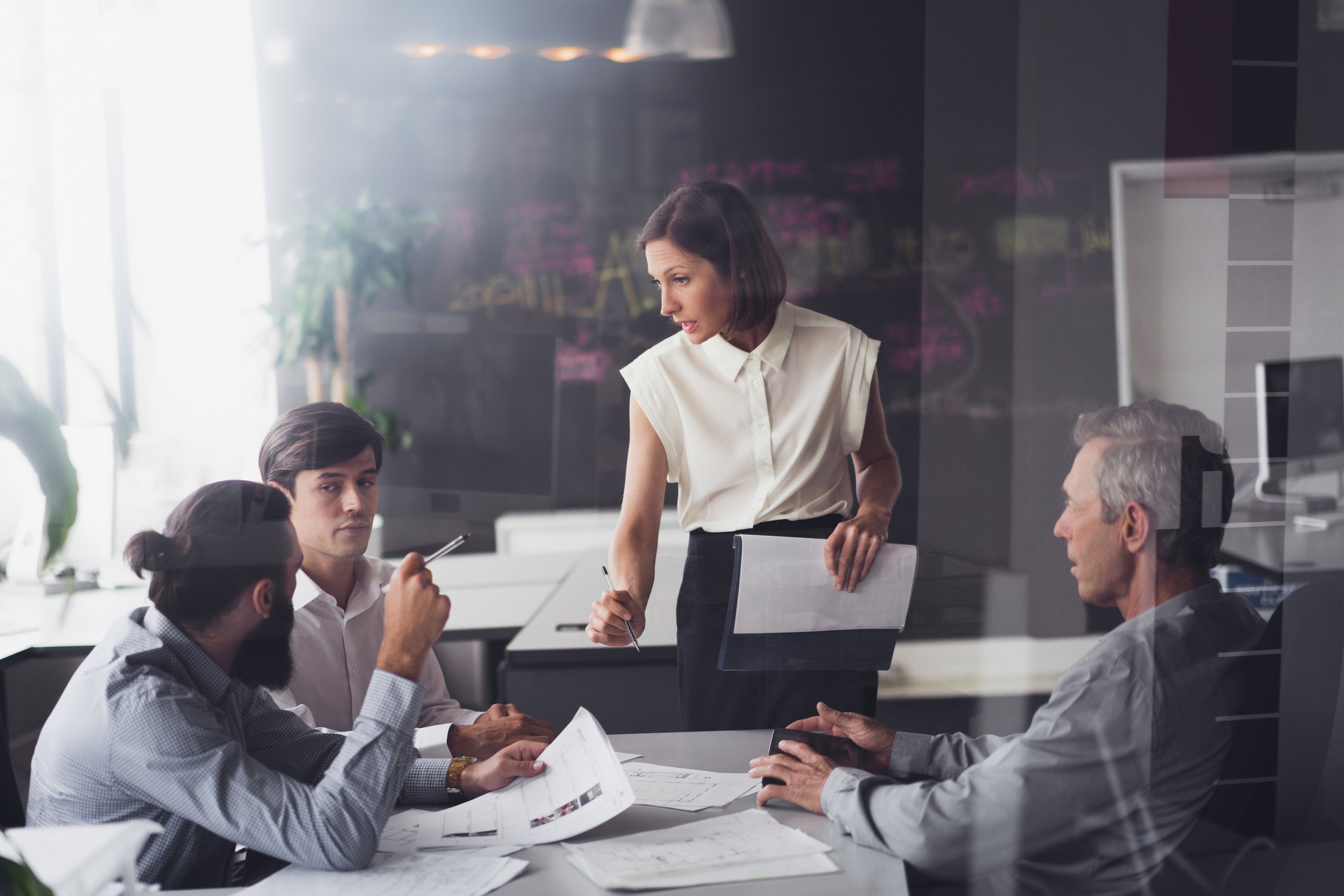 A woman conducting a meeting at work