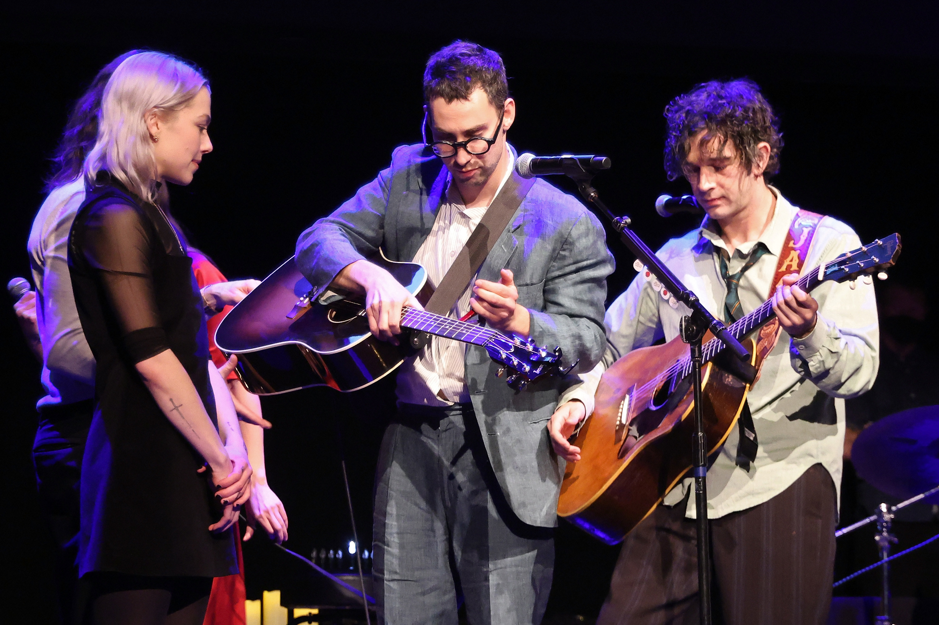 Phoebe Bridgers, Jack Antonoff, and Matty Healy onstage