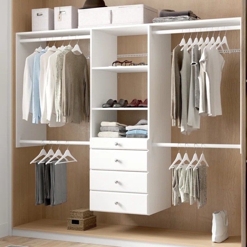 the adjustable-width closet organizer with hanging clothes and folded shirts in shelves