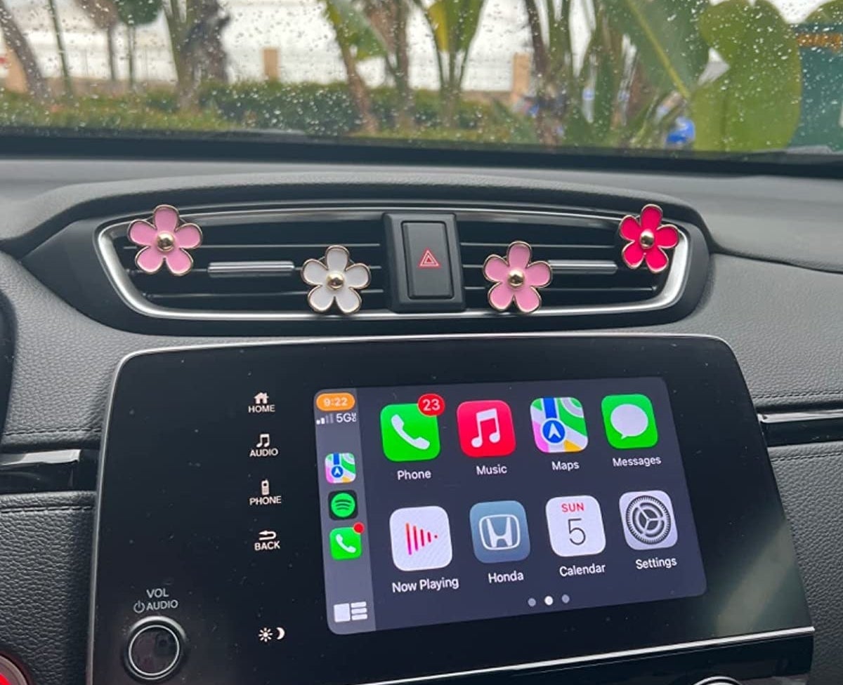 Reviewer image of flower clips on their car air vents