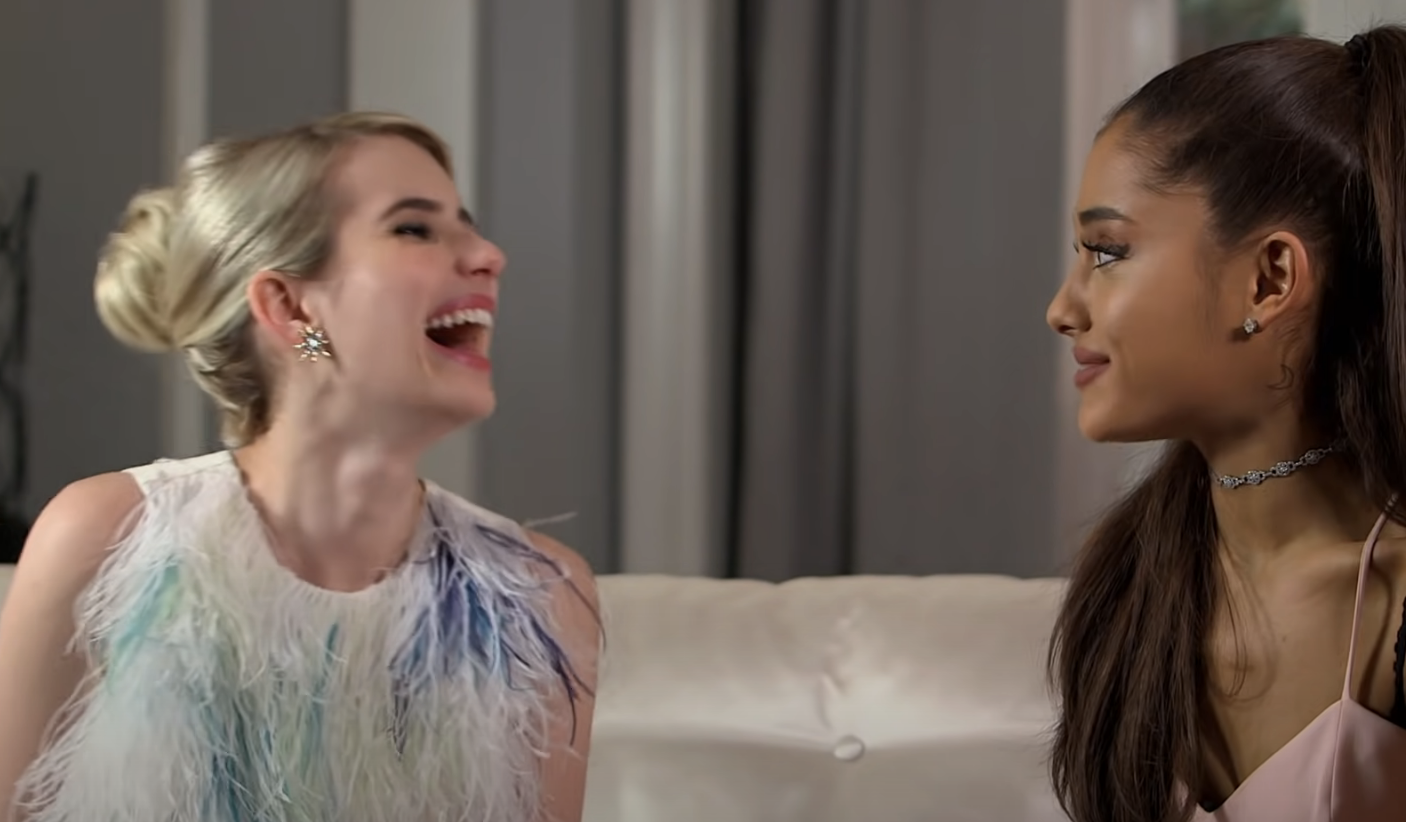 emma laughing while ariana looks at her