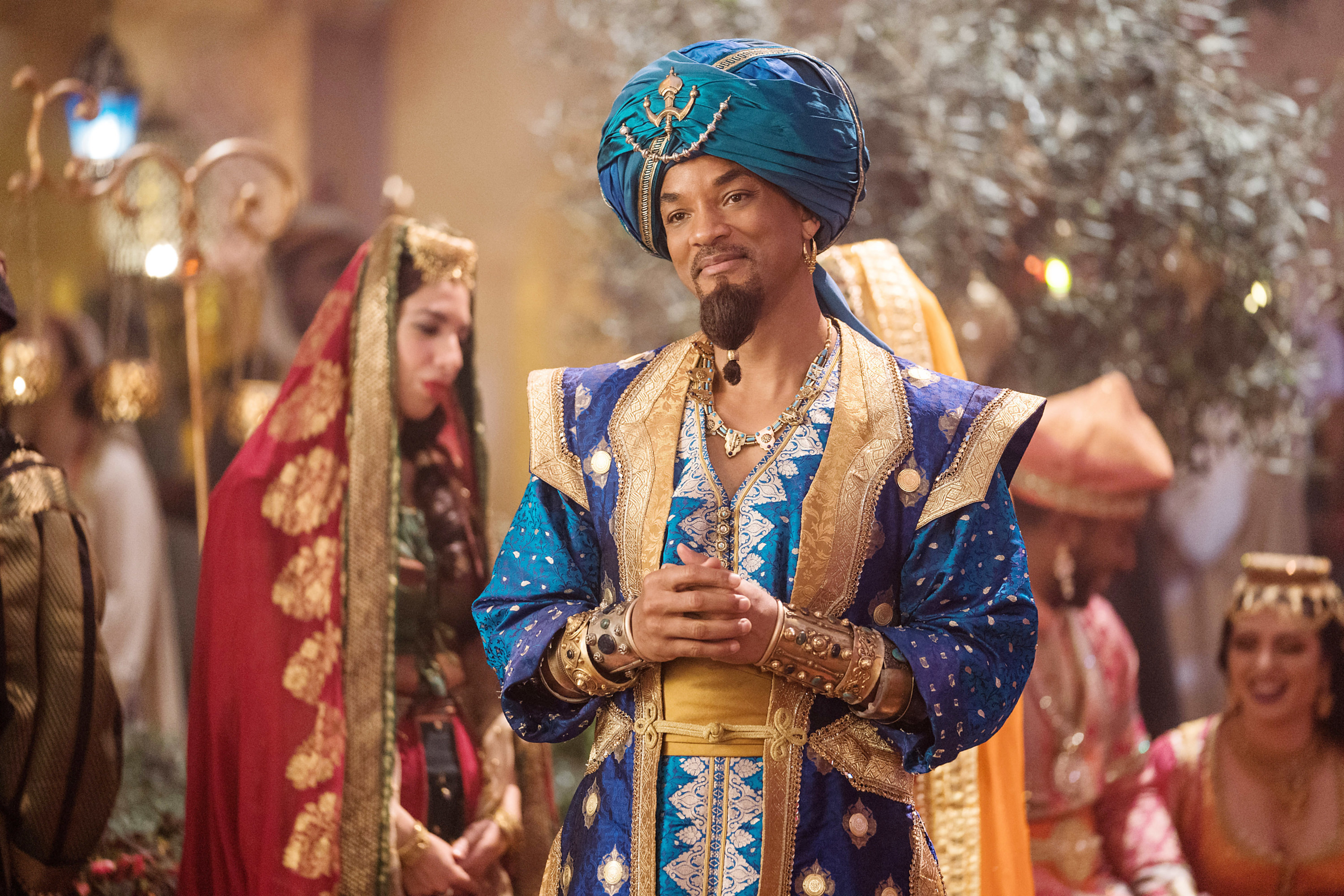 Will Smith as Genie smiling at someone off screen