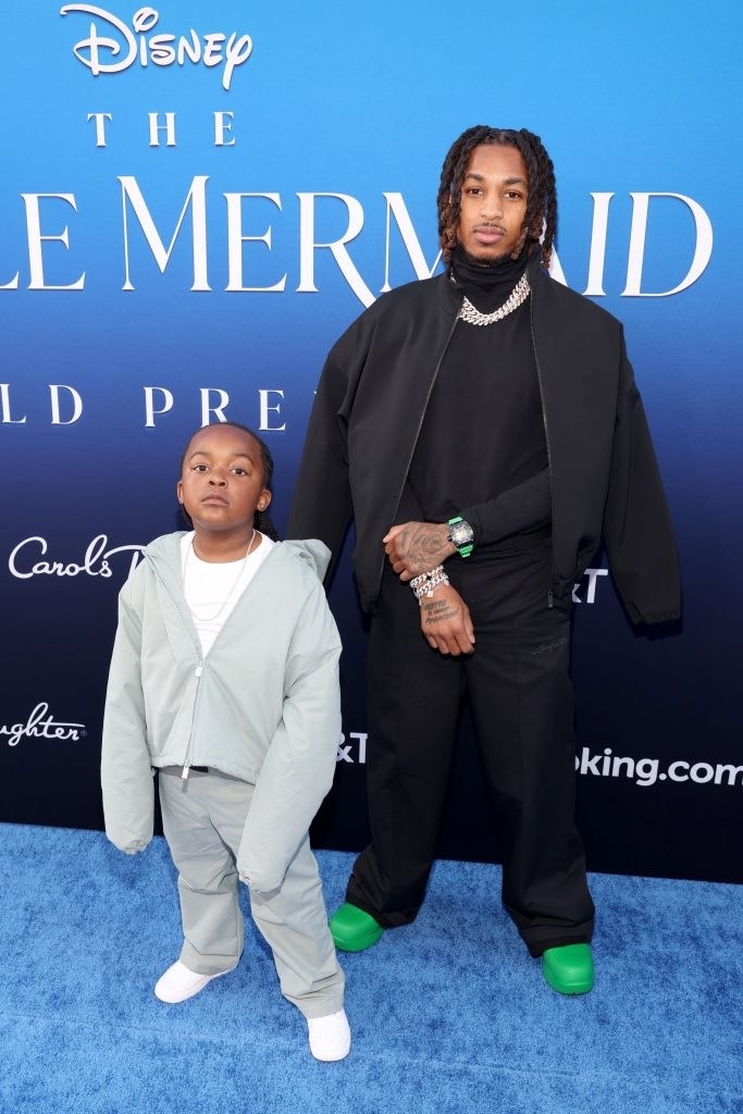 DDG on the red carpet with a child