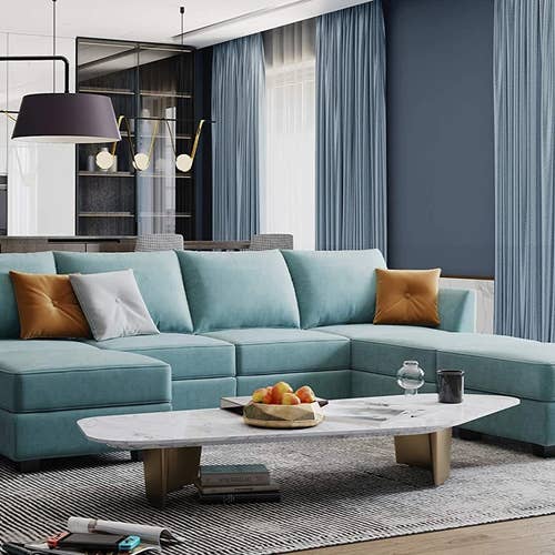 A teal U-shaped sectional is shown in a living room