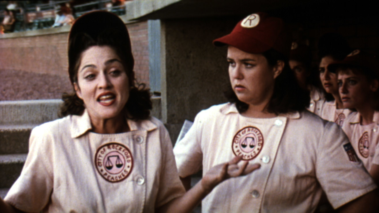Madonna and Rosie O&#x27;Donnell in baseball uniforms, talking