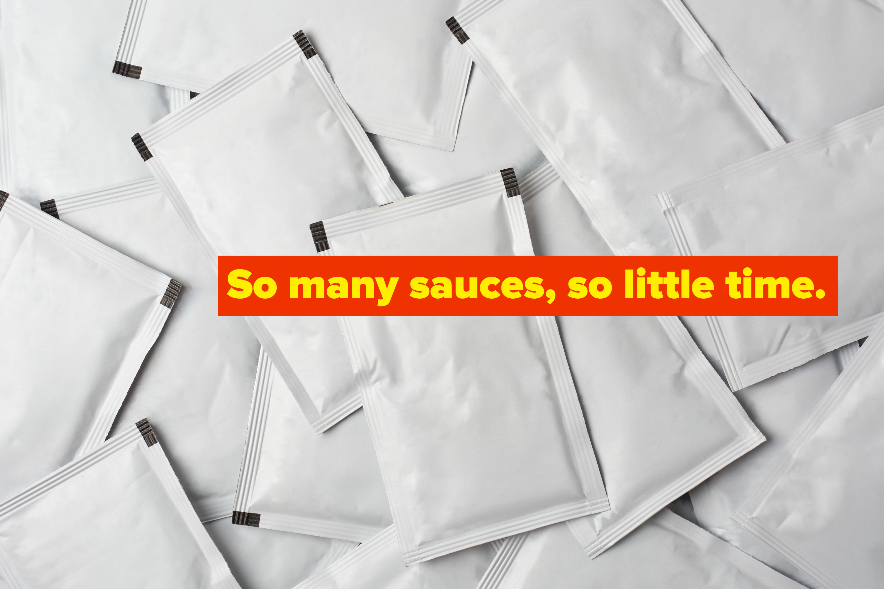 Blank condiment packages that have been piled together haphazardly