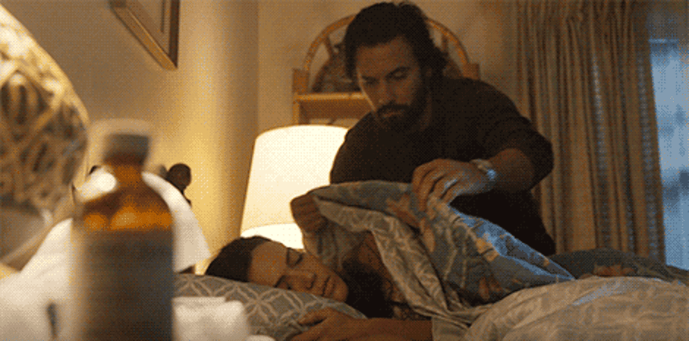 gif of character tucking wife into bed from this is us