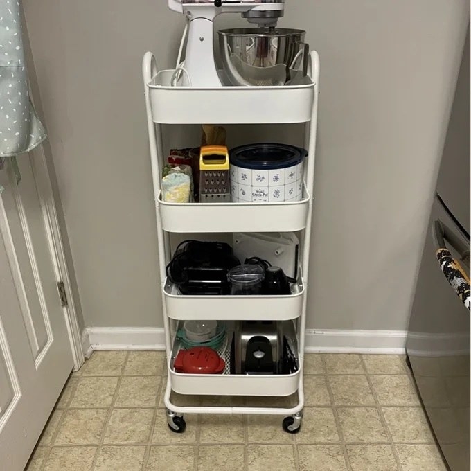 Reviewer image of the white cart with kitchen items on the shelves