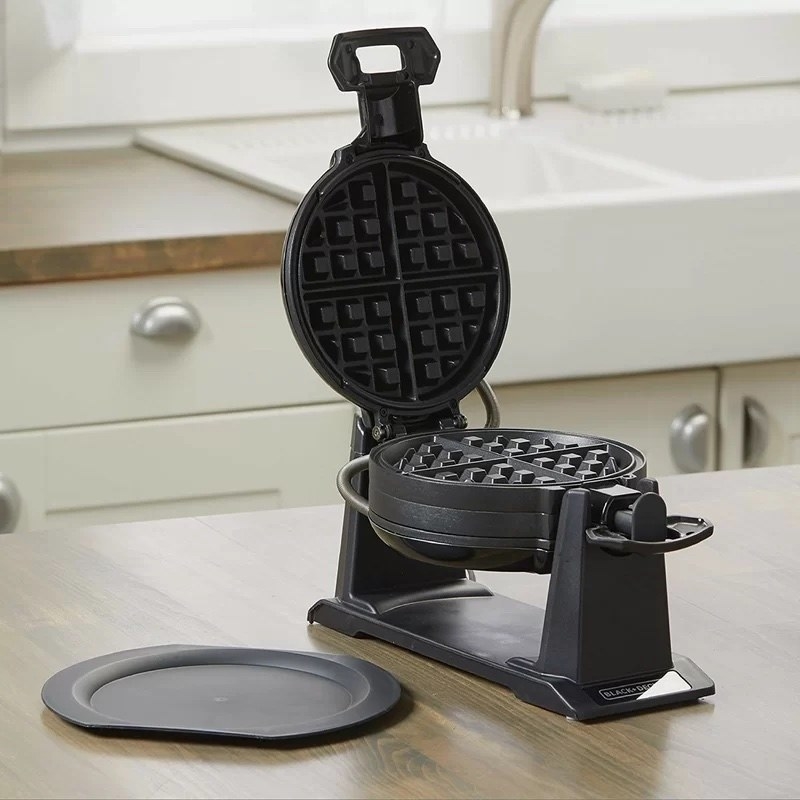The waffle maker on a kitchen counter
