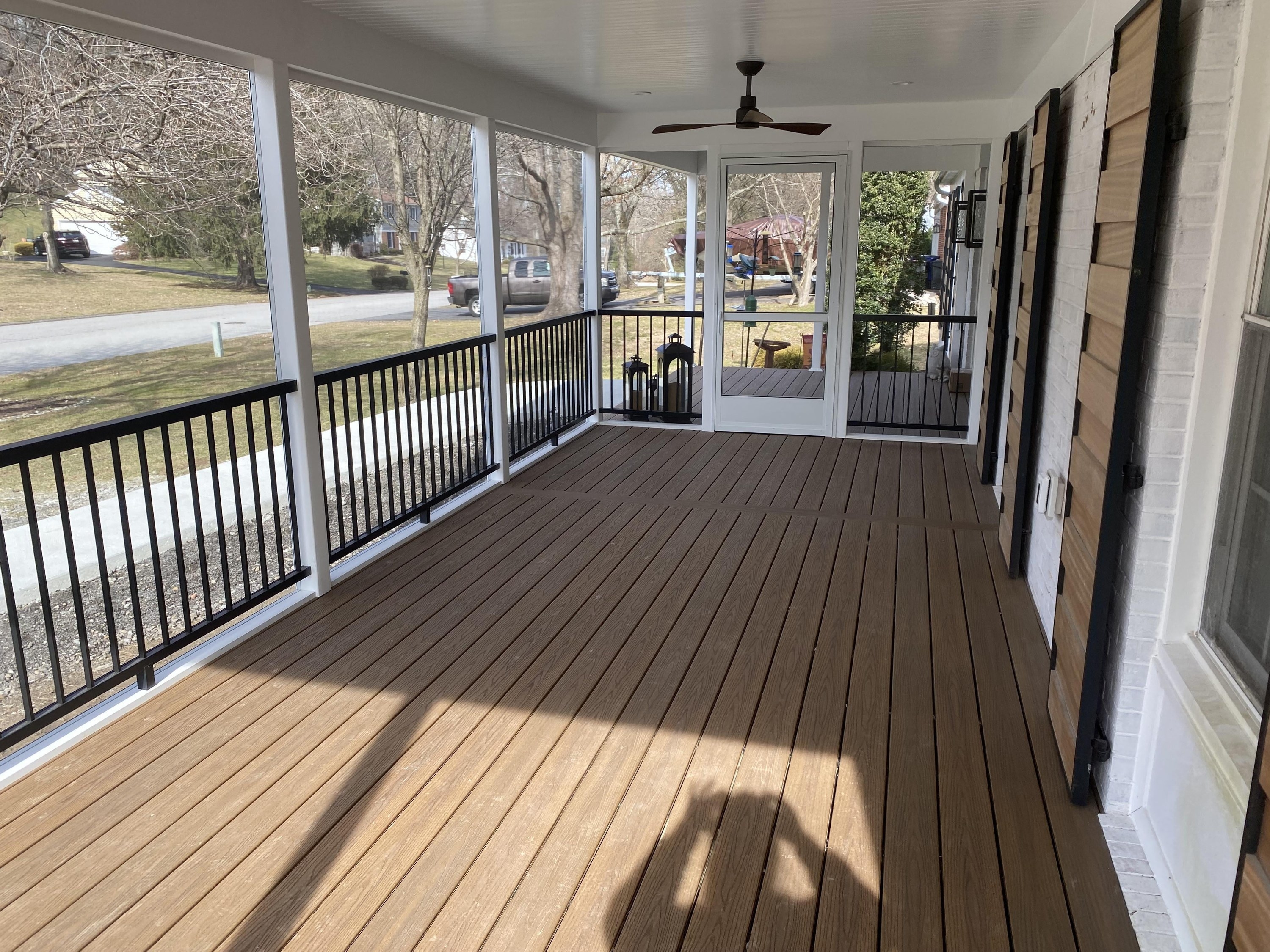 DIY screened in front porch with a ceiling fan