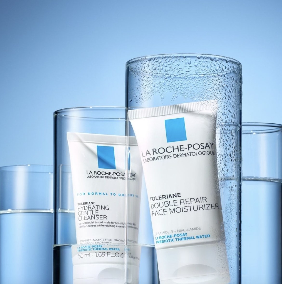 A tube of face moisturizer in a glass
