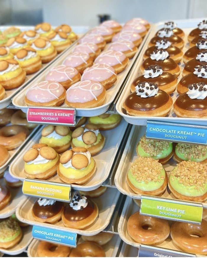 donuts on trays in a store