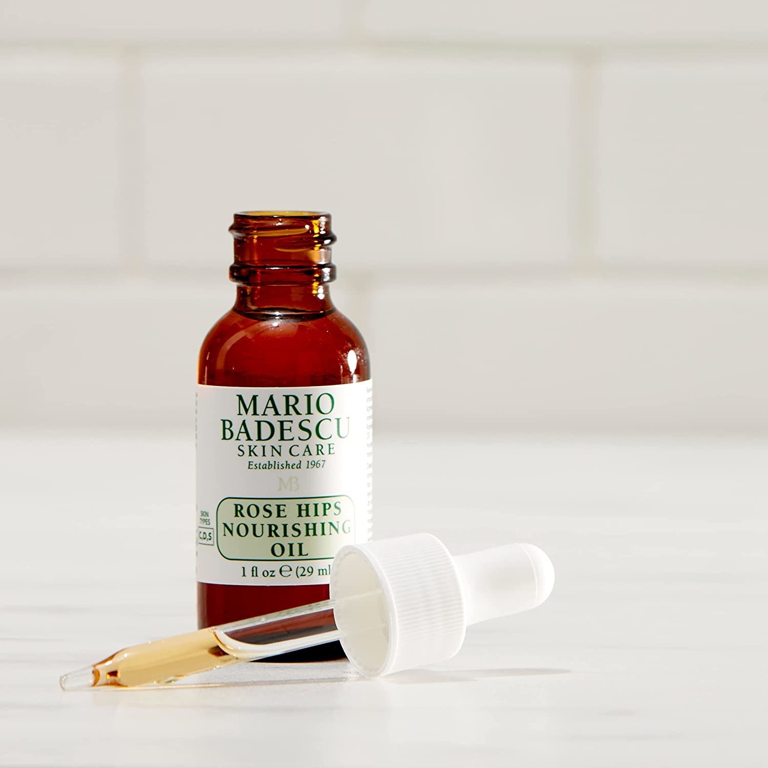 A bottle of Mario Badescu Skincare oil for skin