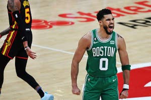 Jayson Tatum of the Boston Celtics celebrates after hitting a three point shot