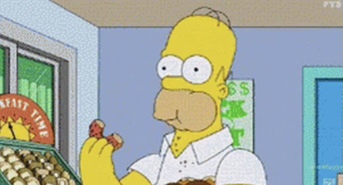 homer simpson biting a donut