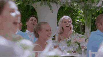 A groomsman doing gun motions