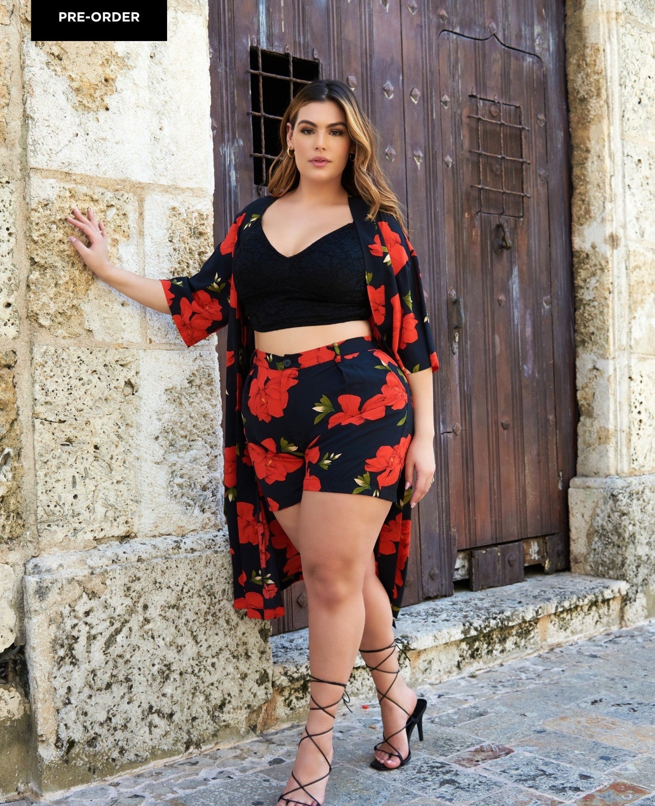 model posing in floral robe and shorts