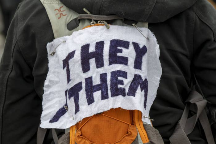 A sign saying, &quot;They Them&quot;